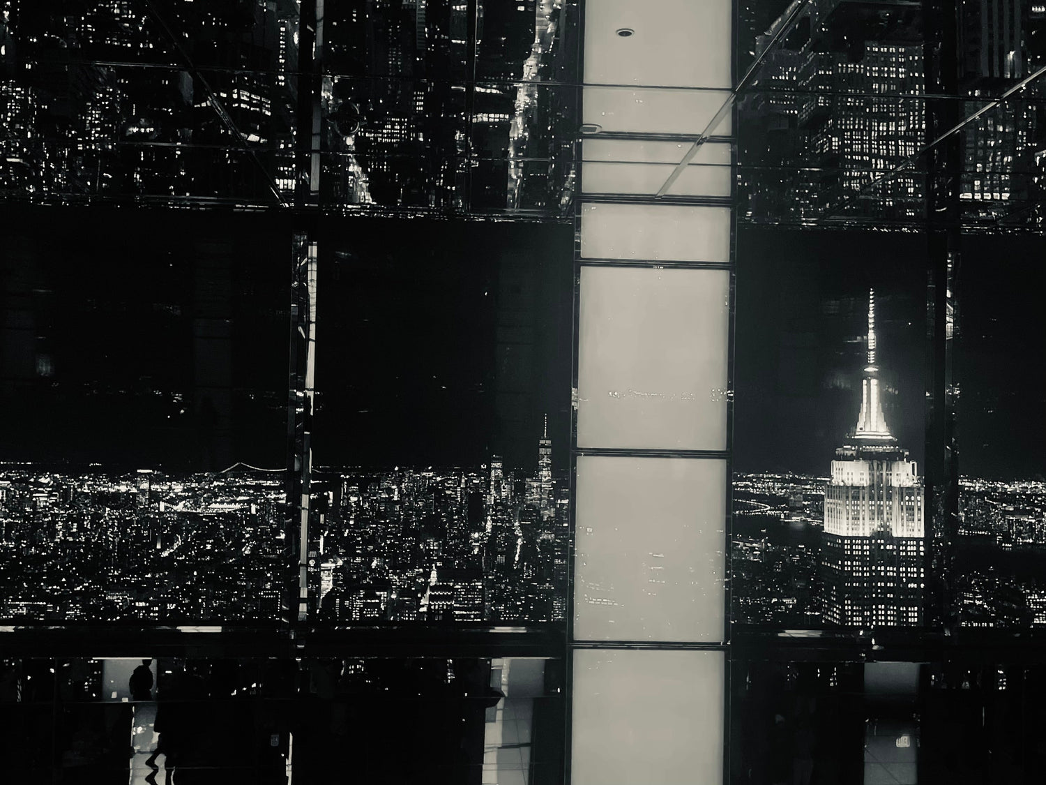 Retail display of keyboard, mouse, and boxed computer peripherals under colorful LED lighting.